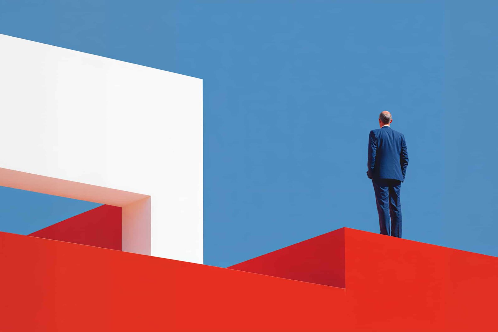 Senior real estate executives reviewing development and investment plans in a boardroom.